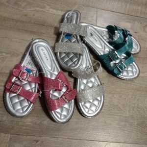 Three pair of Elditas slide sandals.